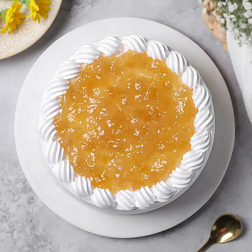 pineapple-cake-half-kg-eggless_2.webp Pineapple Cake Half kg Eggless - Image 1